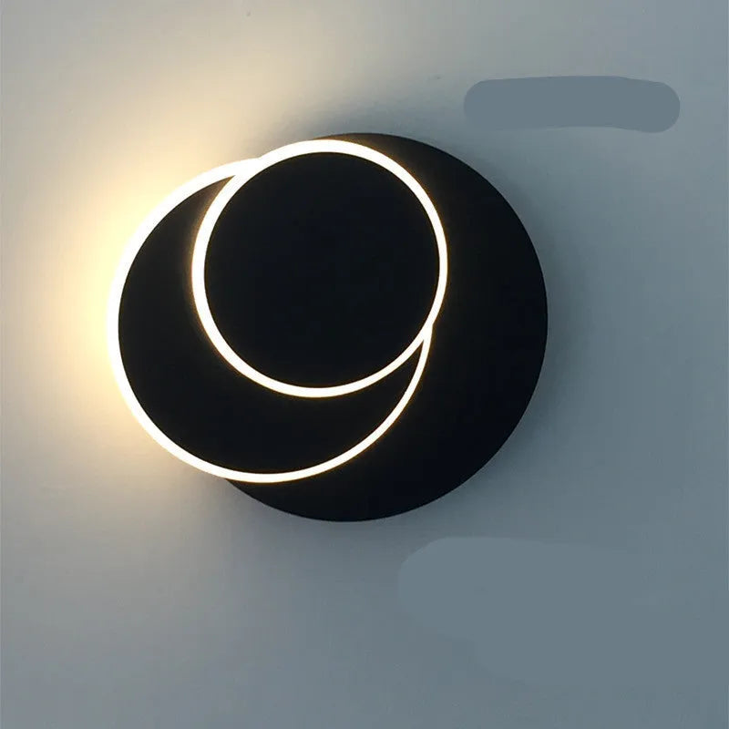 Round acrylic LED wall lamp in black or white with push button switch