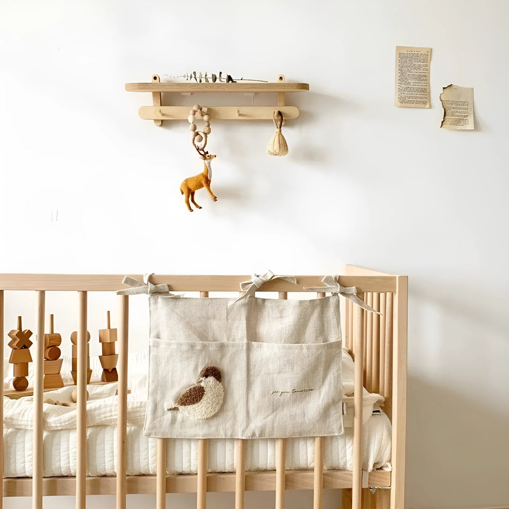 Khaki cotton and linen multi-purpose storage bag hanging beside the bed with single pocket