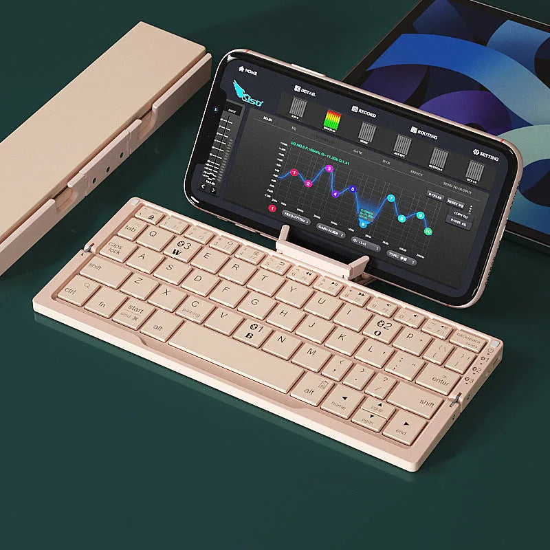 Silver white folding Bluetooth keyboard open with phone on stand and closed showing compact size
