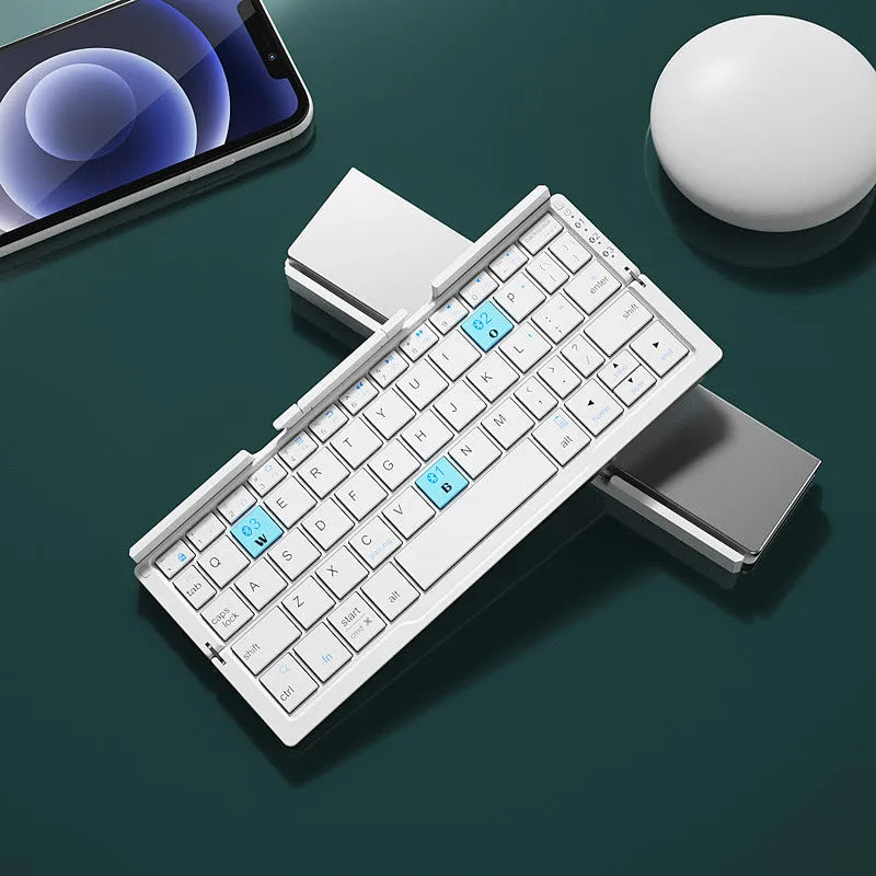 Silver white folding Bluetooth keyboard open with phone on stand and closed showing compact size