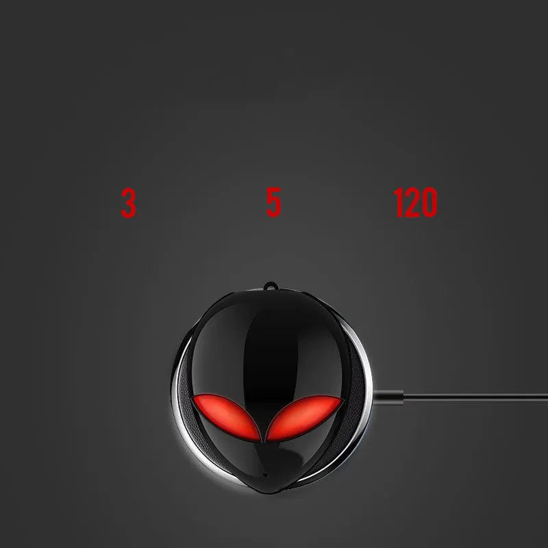 Creative Outer T8 Starman alien design wireless earbuds with LED lights next to charging case.
