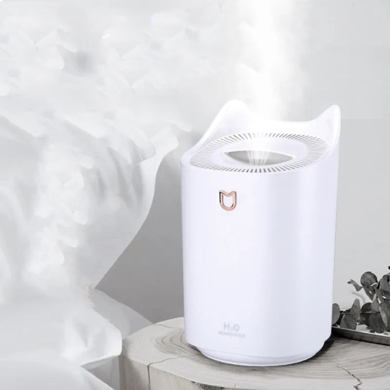 USB-powered double spray humidifier diffuser in coral pink or white with three fog outlets.