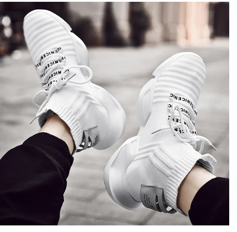Men's black and white casual sports shoes showing mesh lining and available in sizes 39 to 47