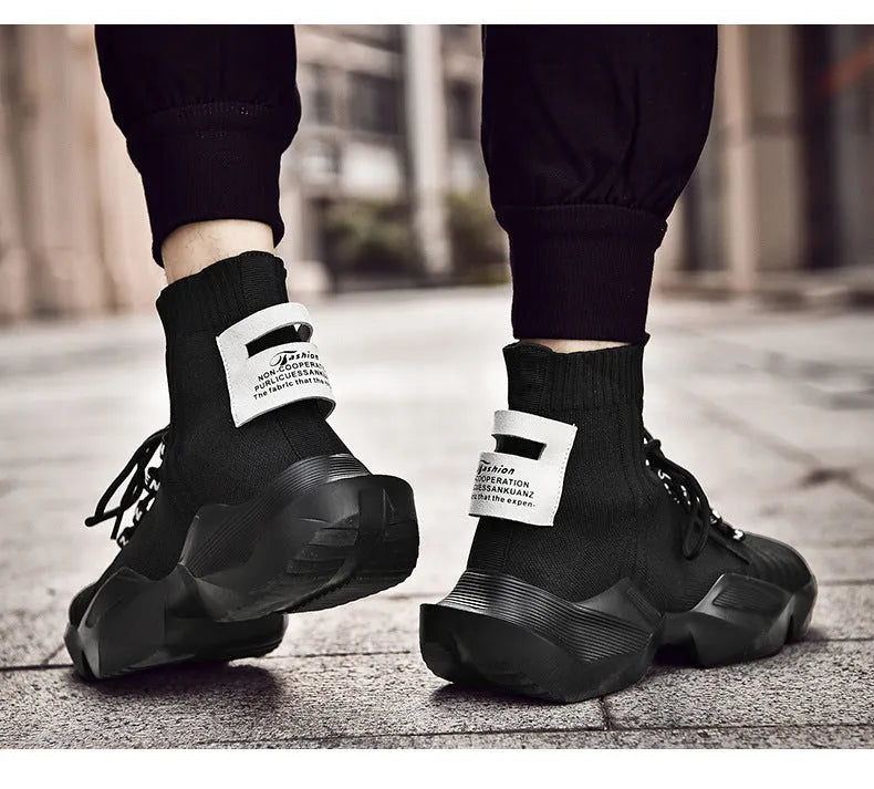 Men's black and white casual sports shoes showing mesh lining and available in sizes 39 to 47