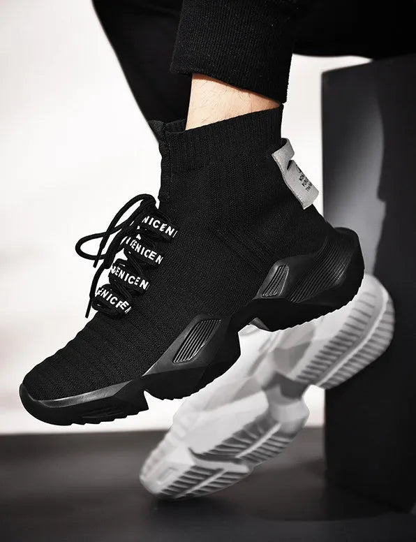 Men's black and white casual sports shoes showing mesh lining and available in sizes 39 to 47