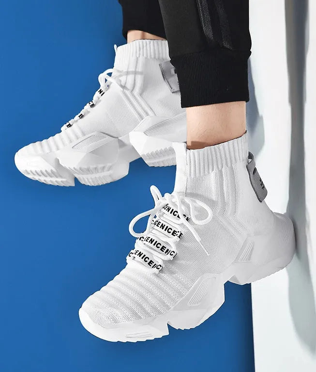 Men's black and white casual sports shoes showing mesh lining and available in sizes 39 to 47