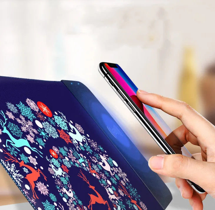 Wireless charging mouse pad with cartoon design showing RGB lighting and USB cable connection