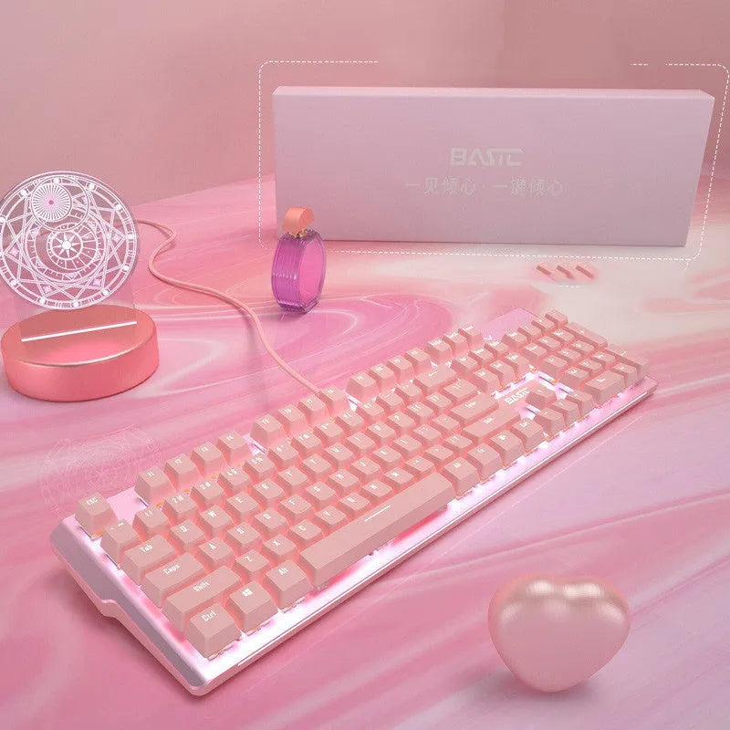 Pink mechanical keyboard and wired mouse gaming peripheral set on desk