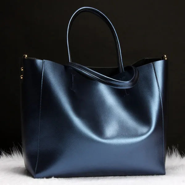 Women's cowhide leather shoulder bag shown in multiple colours with adjustable strap.