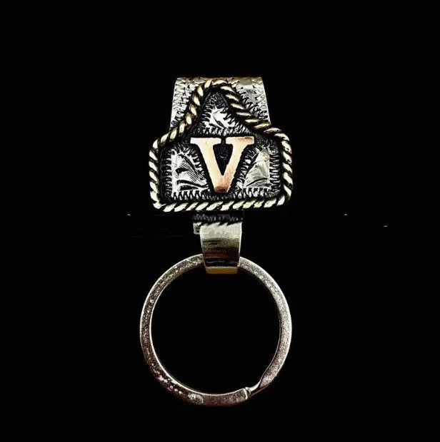Handmade stainless steel cow tag belt key holder with engraved number plate on a split ring.