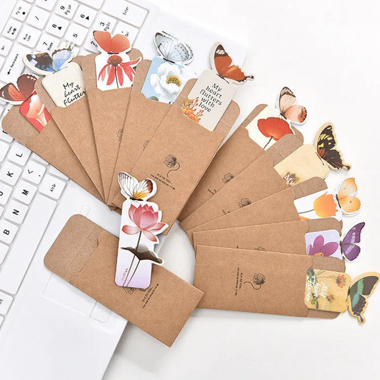 A paper butterfly bookmark measuring 13.5 by 5.5 centimetres.