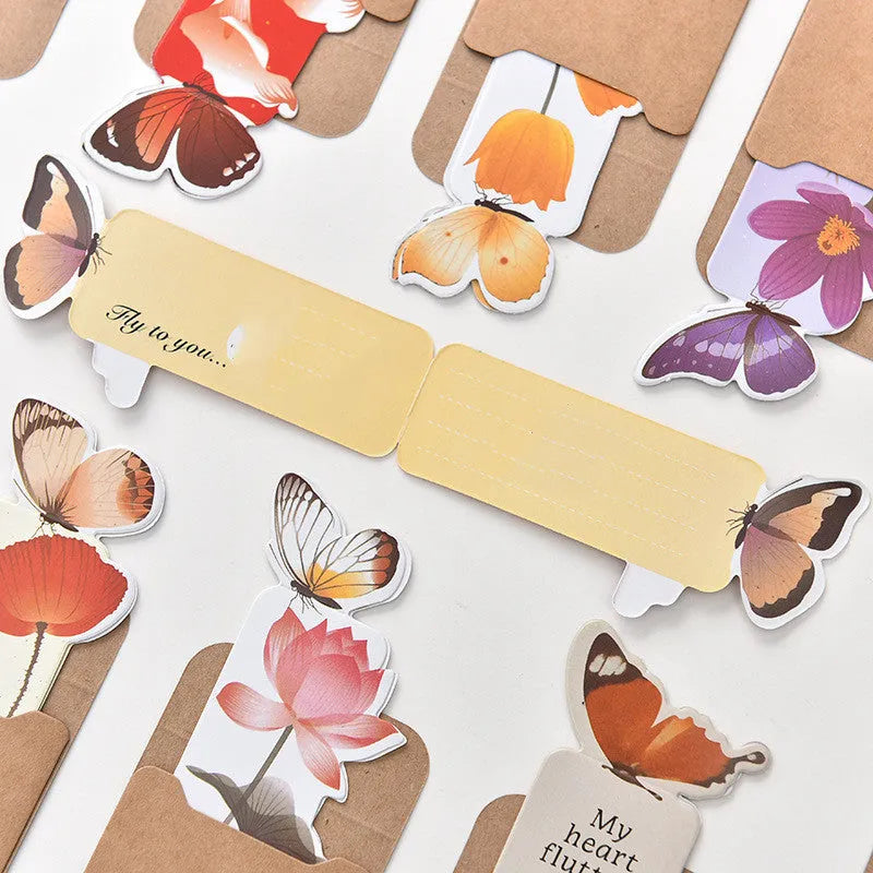 A paper butterfly bookmark measuring 13.5 by 5.5 centimetres.