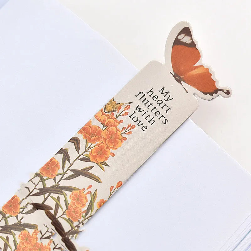 A paper butterfly bookmark measuring 13.5 by 5.5 centimetres.