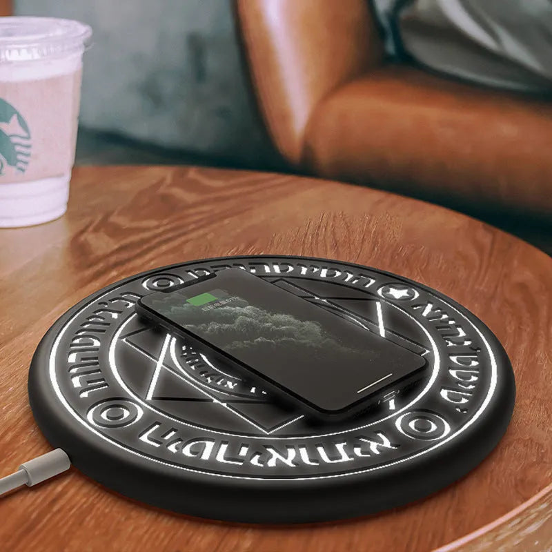 Square wireless phone charger with glowing magic array pattern showing 10W fast charging