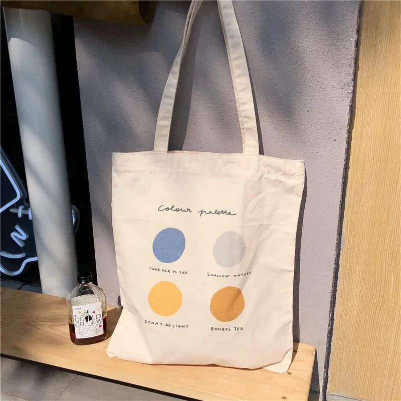 Women's canvas tote shopper bag with geometric pattern, shoulder straps, and zipper closure in orange or light pink colour