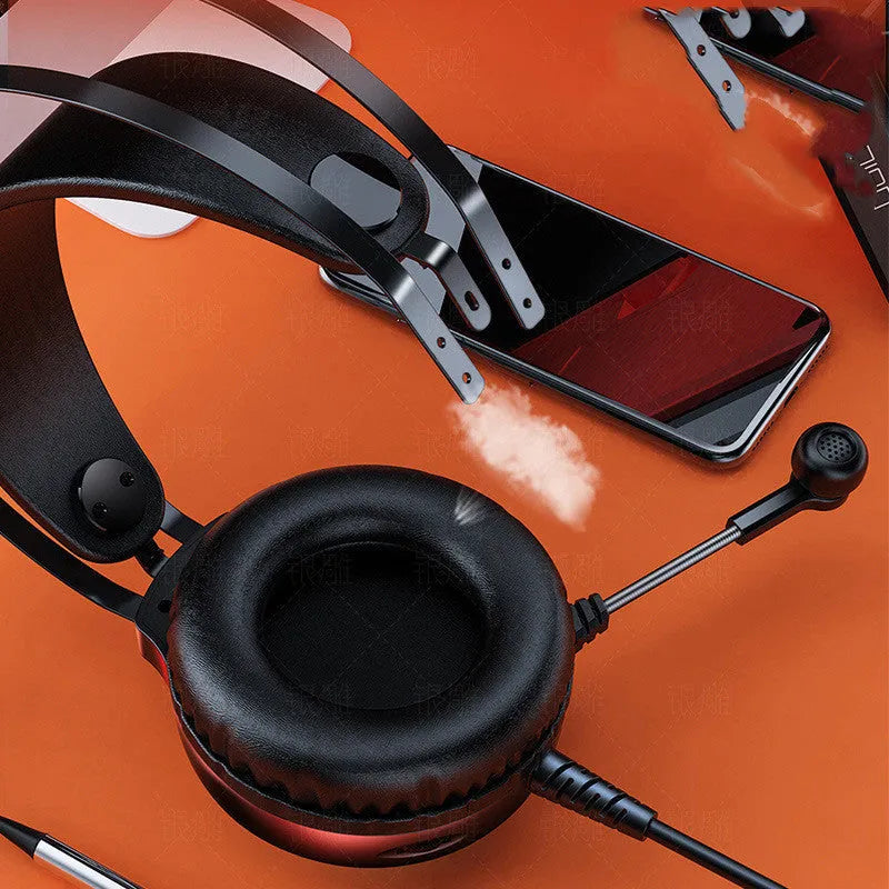 Black wired computer headset with microphone and protein earmuffs, showing 3.5mm plug