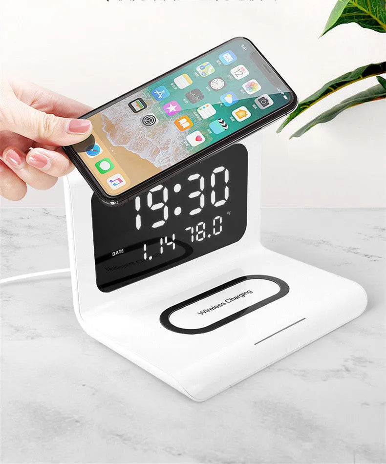 White wireless charger alarm clock with perpetual calendar display showing time, temperature and humidity