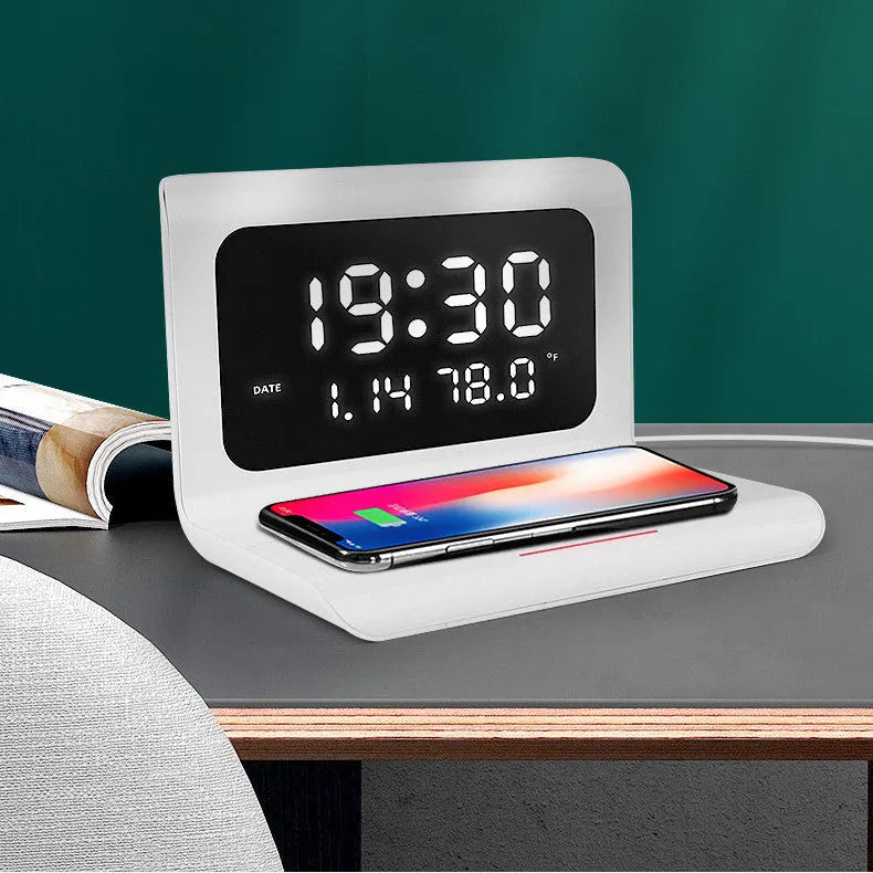 White wireless charger alarm clock with perpetual calendar display showing time, temperature and humidity