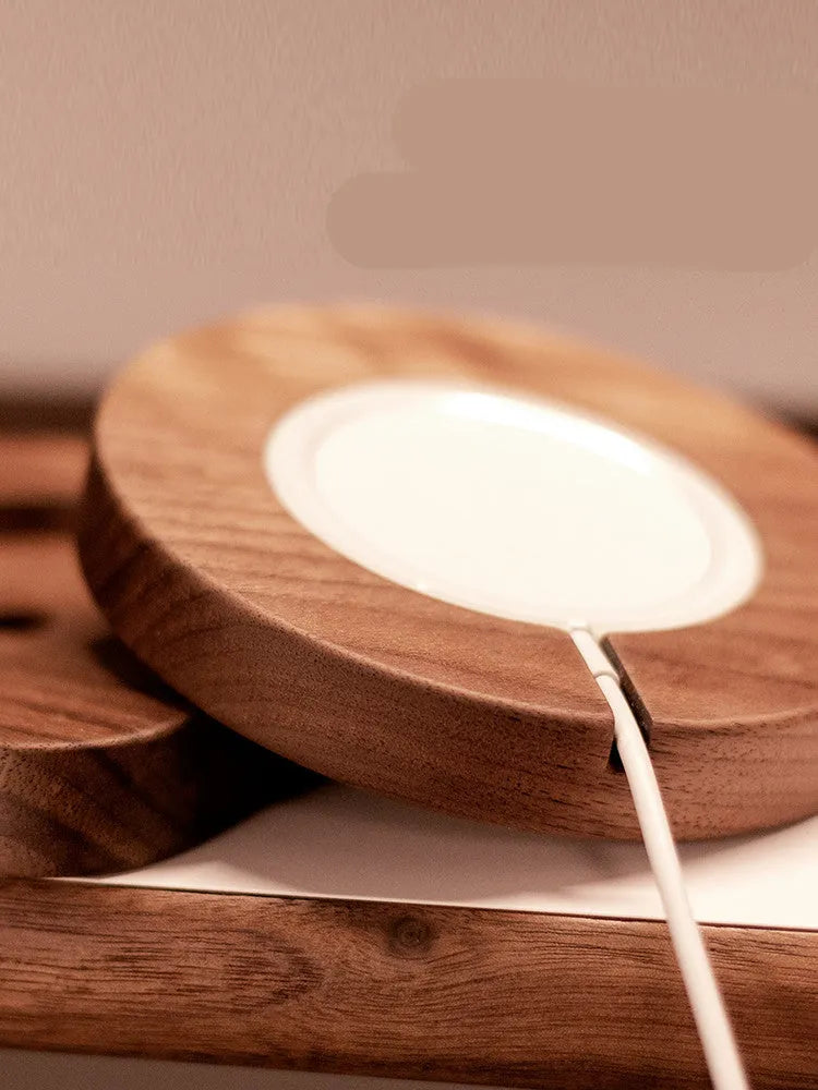 Walnut wood magnetic wireless charging base with protective cover on desktop
