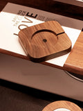 Walnut wood magnetic wireless charging base with protective cover on desktop