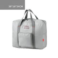 Foldable large capacity canvas travel bag in grey with soft handle and zipper pocket
