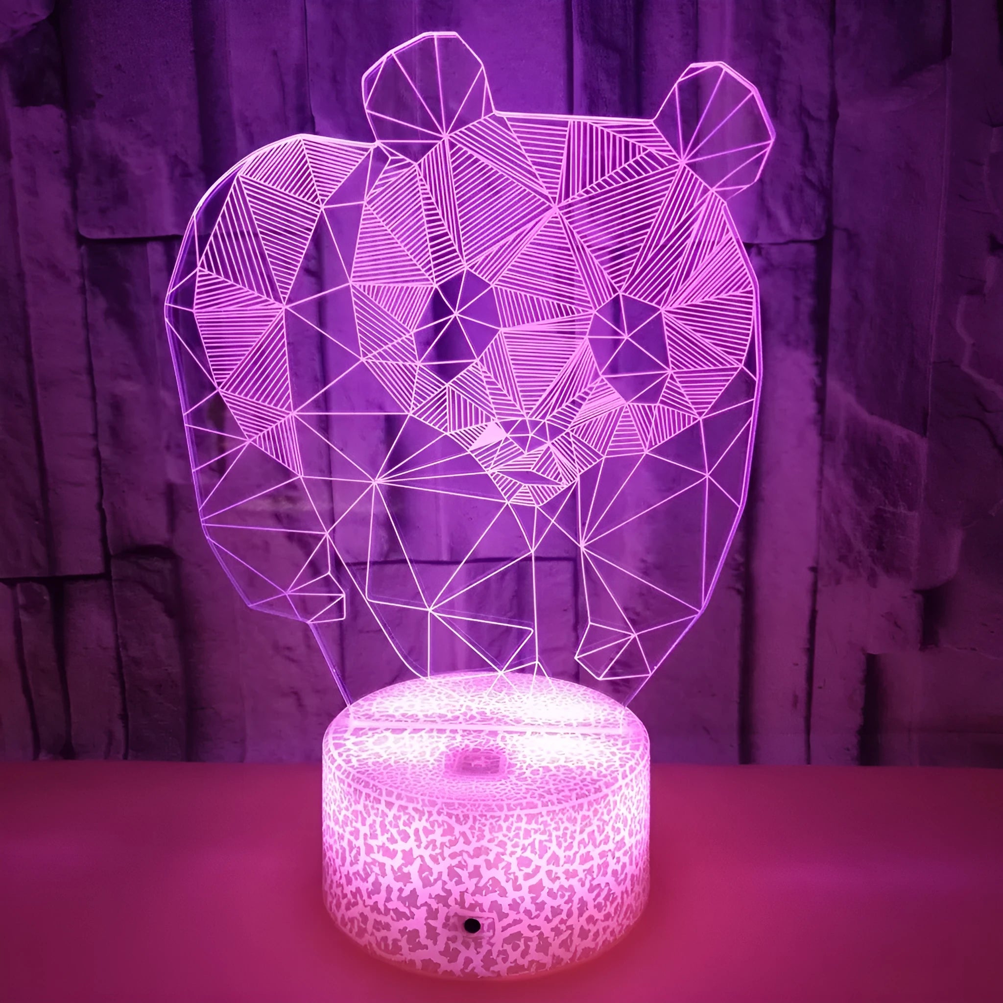 Panda colorful LED 3D night light with remote control showing seven colour gradient on a bedroom shelf