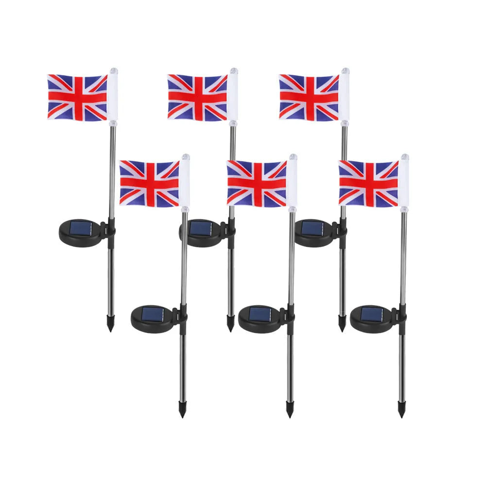 Solar-powered garden flag light displaying either American or British flag design with stainless steel pole and solar panel