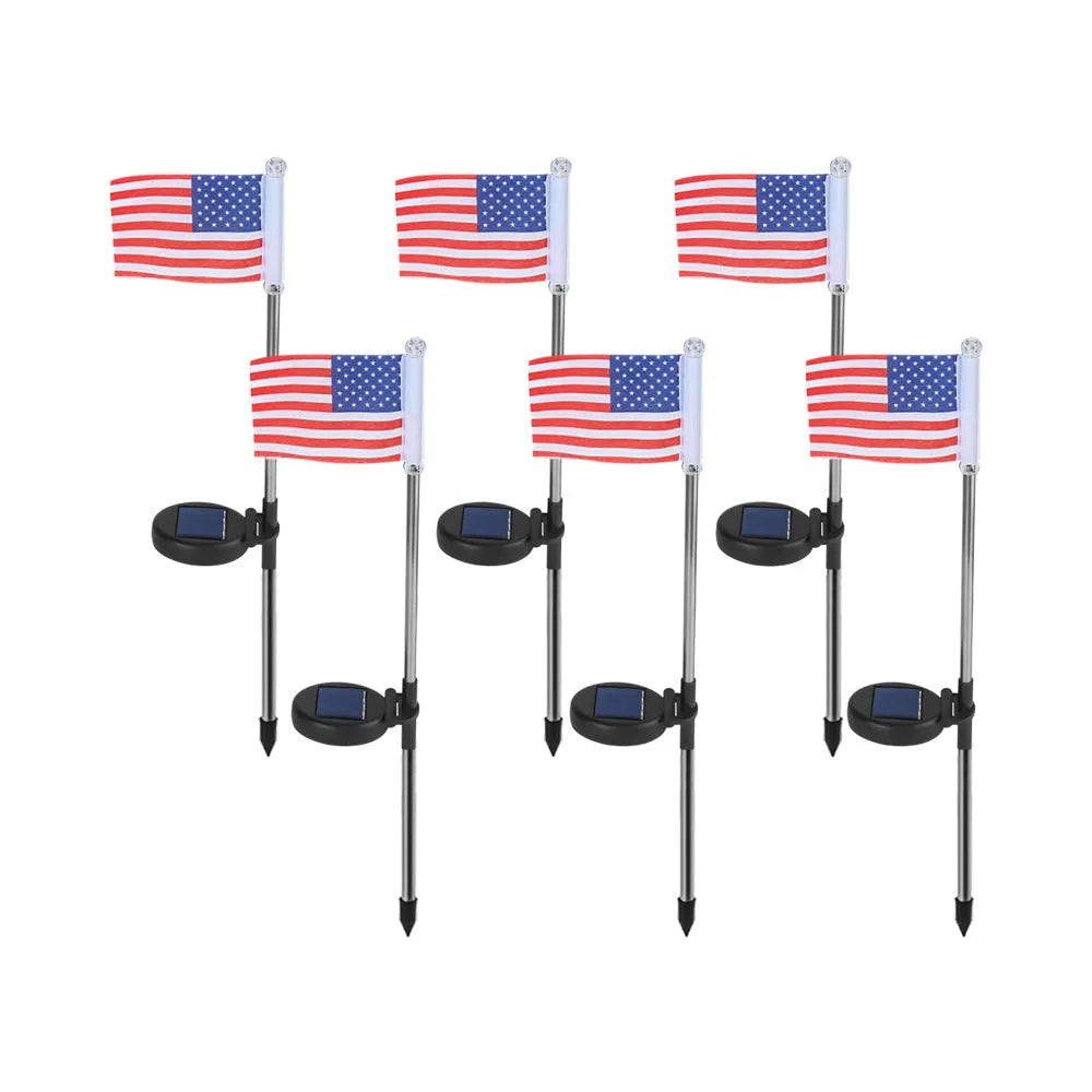 Solar-powered garden flag light displaying either American or British flag design with stainless steel pole and solar panel
