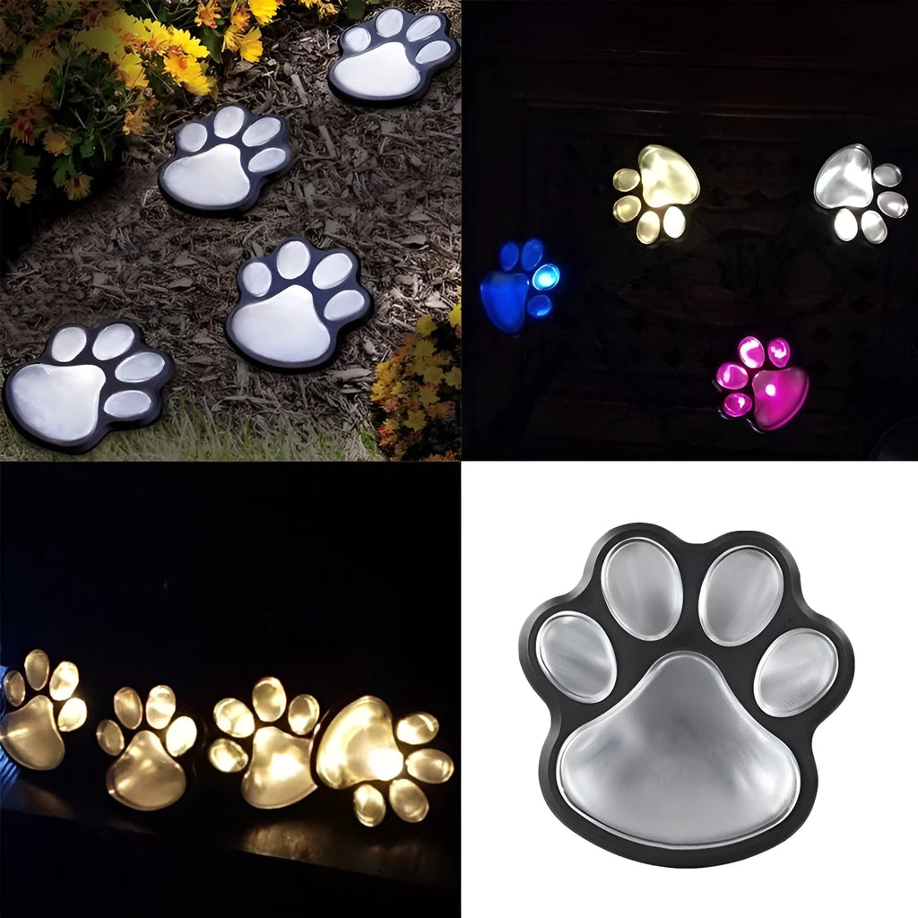 Black solar powered animal paw print LED garden lights set with four paw shapes and solar panel
