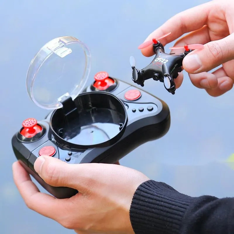 30cm fixed height remote control aircraft in bright gold colour with four blades and handle remote control