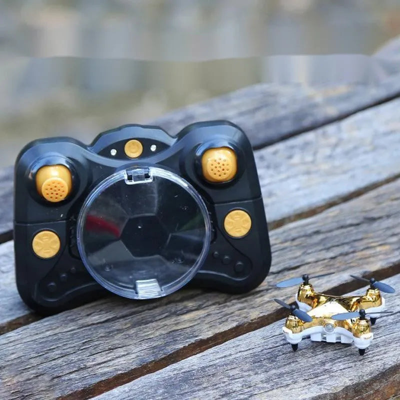 30cm fixed height remote control aircraft in bright gold colour with four blades and handle remote control