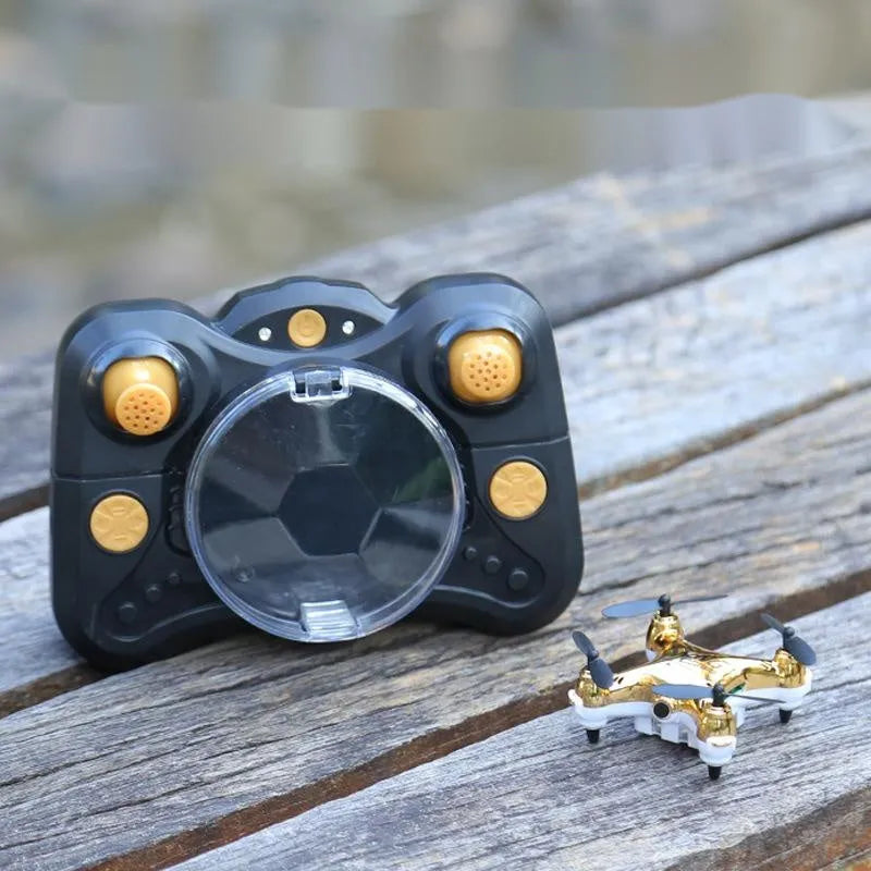 30cm fixed height remote control aircraft in bright gold colour with four blades and handle remote control