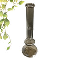 Small pure colour glass geometric vase on a tabletop, American style decorative ornament.