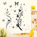 PVC wall sticker showing butterfly and flower design in photo colour on a white wall, size 50x70cm
