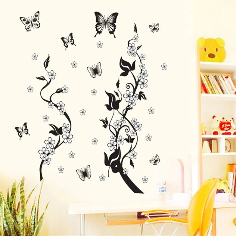PVC wall sticker showing butterfly and flower design in photo colour on a white wall, size 50x70cm