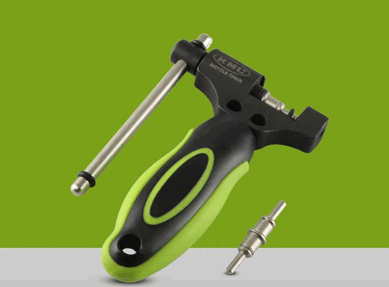 Green steel bicycle chain repair tool with double shaft chaining mechanism on a white background.
