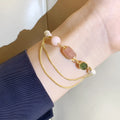 Women's pink freshwater pearl bracelet with geometric strawberry crystal charms