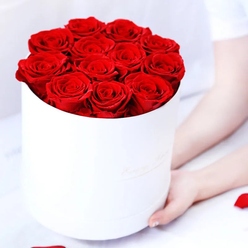 Handmade everlasting rose in hug bucket with preserved flower material, available in white red pink black blue colours