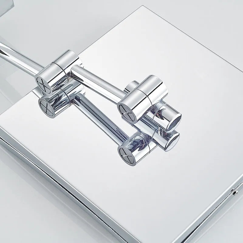 8.5 inch stainless steel folding makeup mirror on a table, shown in silver finish with adjustable angle.