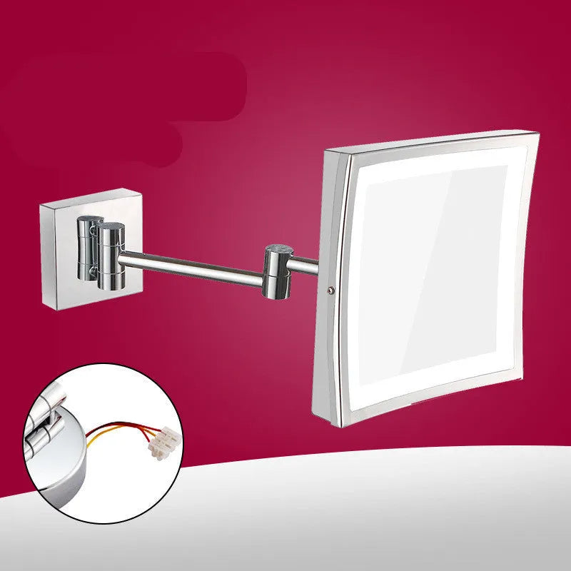 8.5 inch stainless steel folding makeup mirror on a table, shown in silver finish with adjustable angle.