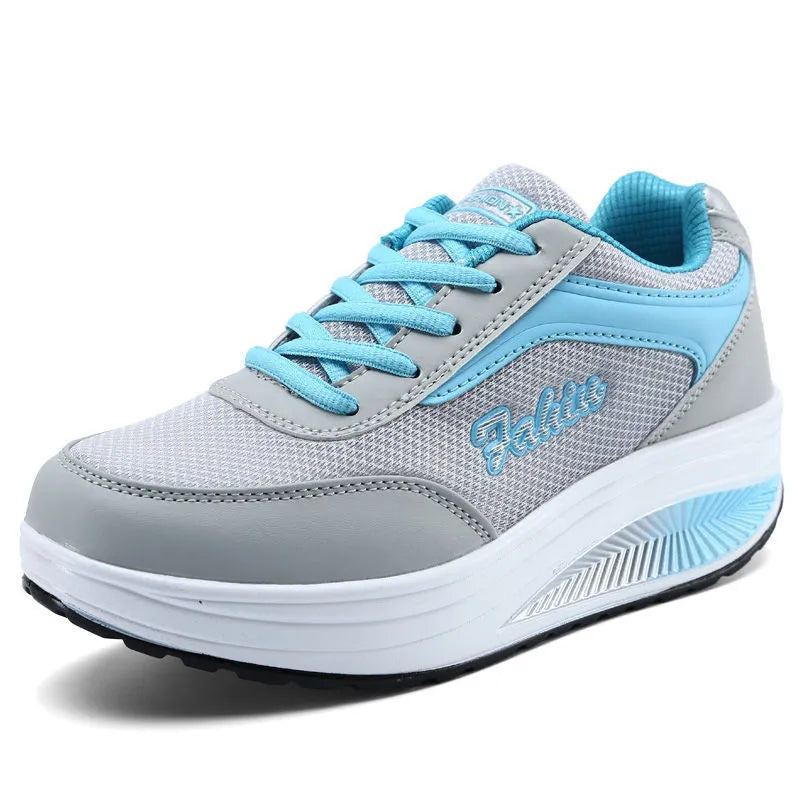 Women's grey powder mid-heel heelless travel and sports shoes on a white background.