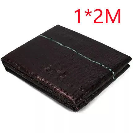 Black composite woven polyethylene weed-proof cloth roll for agricultural greenhouse use.
