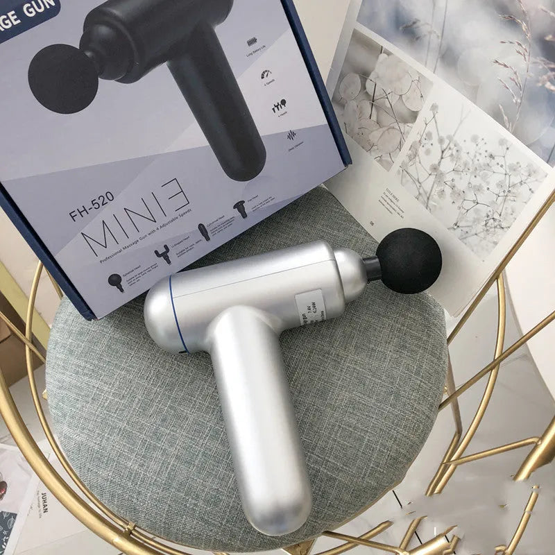 Black fascia gun massager with USB charging port for muscle relaxation therapy.