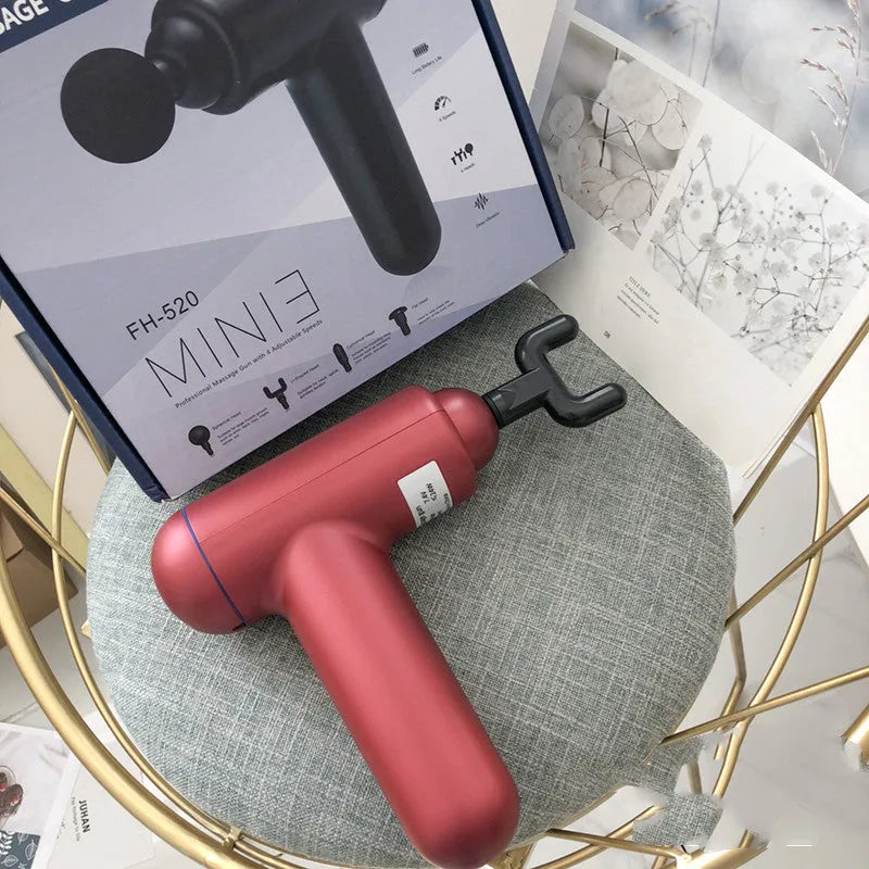 Black fascia gun massager with USB charging port for muscle relaxation therapy.