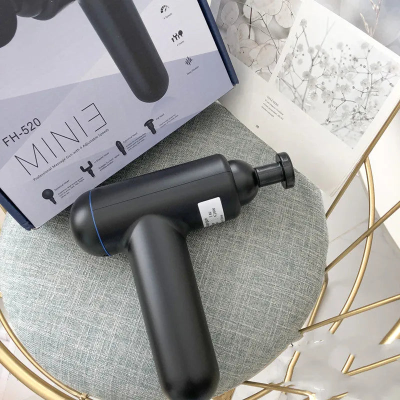 Black fascia gun massager with USB charging port for muscle relaxation therapy.