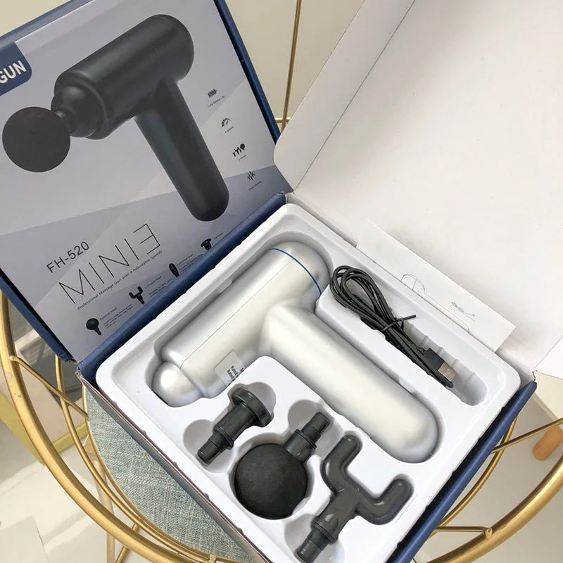 Black fascia gun massager with USB charging port for muscle relaxation therapy.