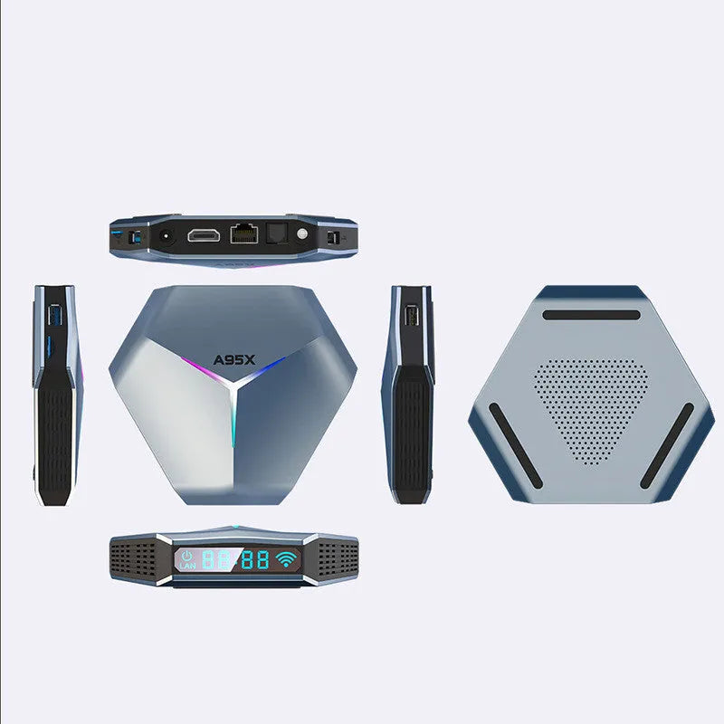 Android TV set-top box for 8K streaming with remote control and cables on a table.