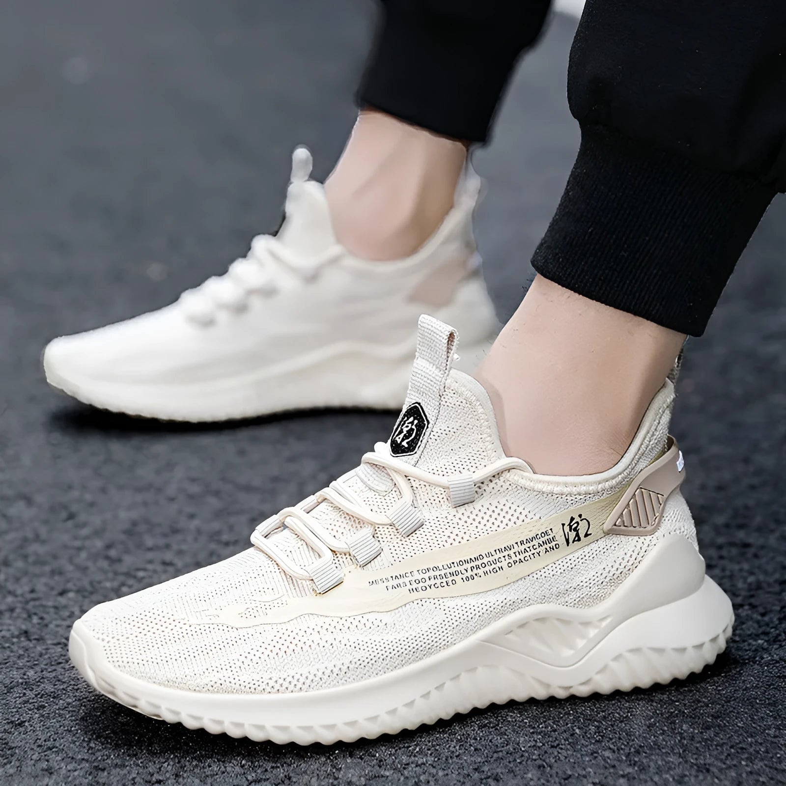 Men's low-top white casual sports shoes with mesh upper and rubber sole on plain background