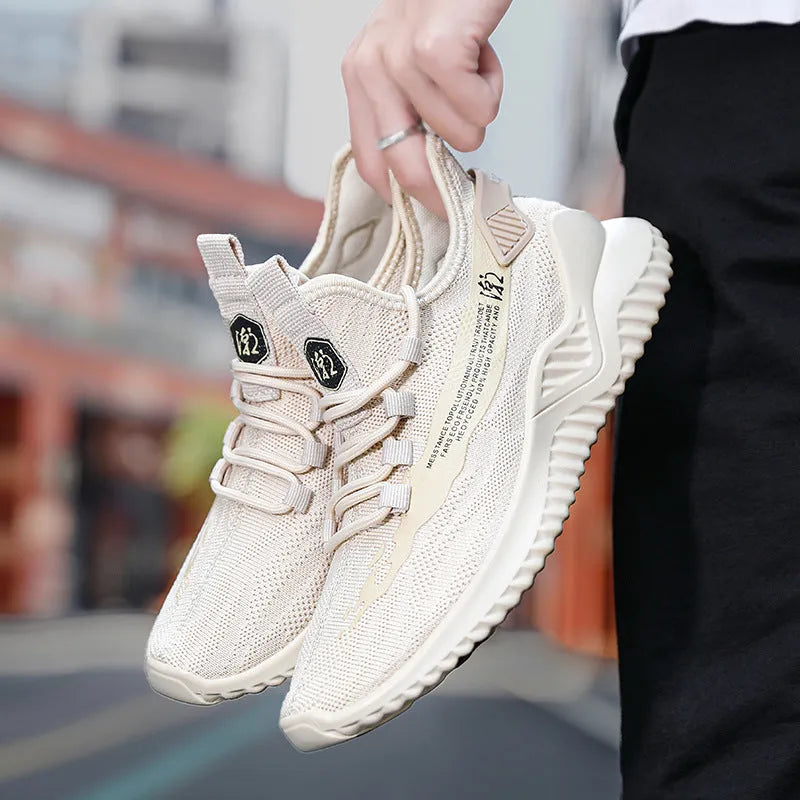 Men's low-top white casual sports shoes with mesh upper and rubber sole on plain background