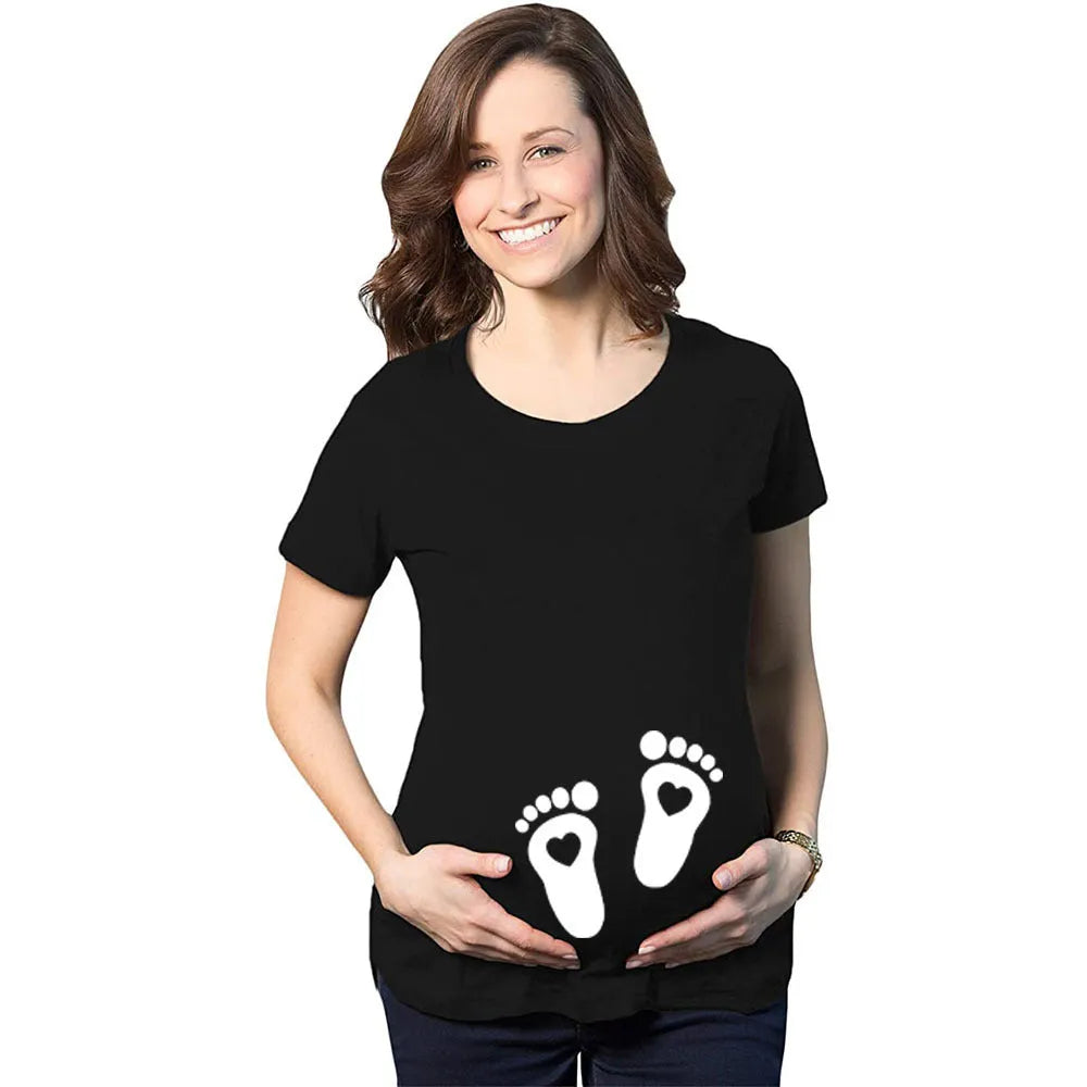 White cotton maternity t-shirt with hand print pattern, round collar, short sleeves on model